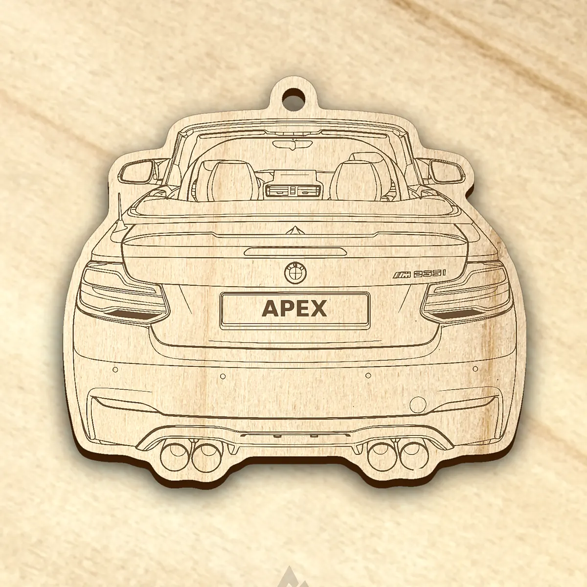 The same car laser-engraved into a walnut keychain blank